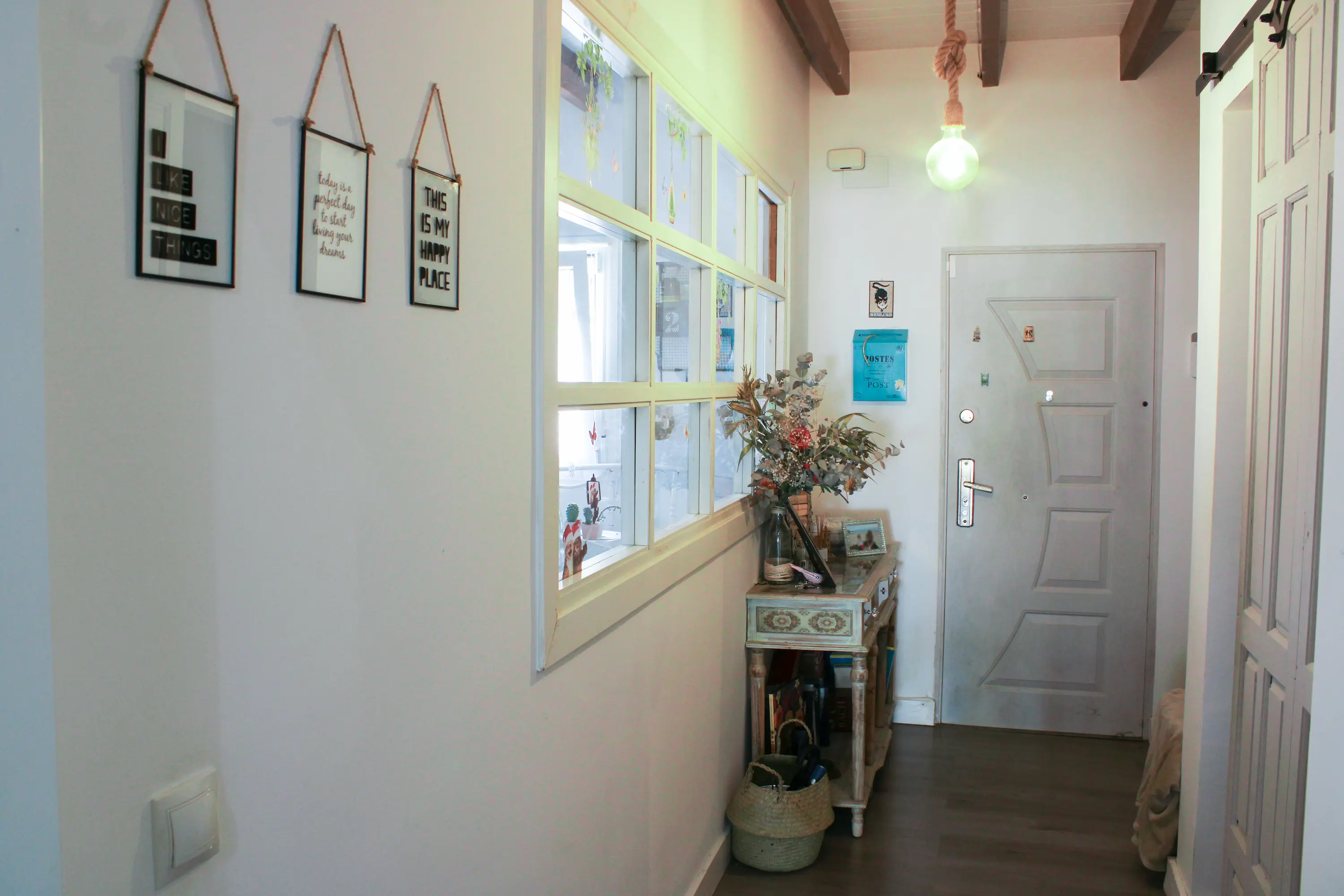 Entrance hallway with the front door and a side console table